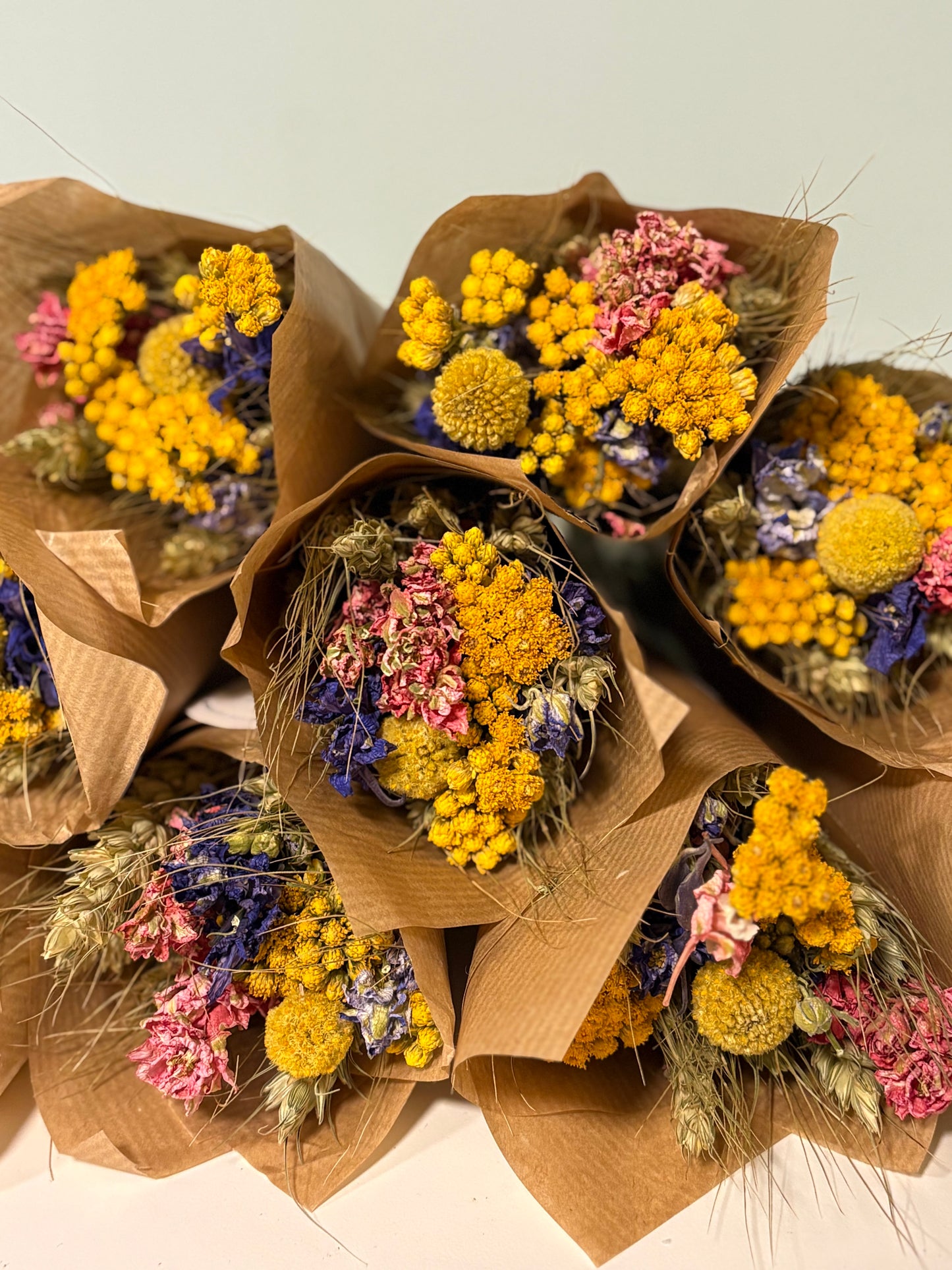 Mini pastel dried flower bouquet (10–12cm) wrapped in kraft paper
UK-grown pastel dried flower posy with mixed stems
Hand-tied pastel mini wildflower bouquet in cream, blush and lilac
Kraft-wrapped mini boho dried flower arrangement (pastel tones)