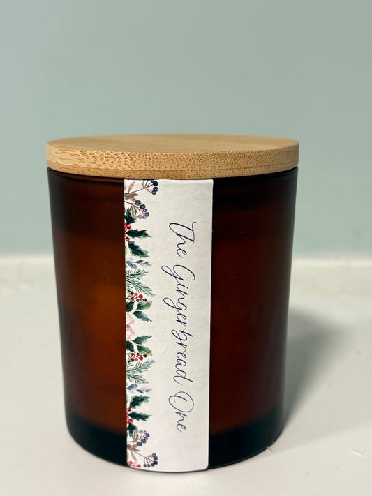 Gingerbread candle with crackling wood wick in amber jar

Hand-poured gingerbread soy candle with boho botanical label

Wood wick Christmas candle with warm spiced fragrance

Gingerbread scented candle styled with festive decor